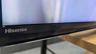 Hisense U8N (65U8N) 75-inch TV close up on bottom of TV frame showing Hisense logo