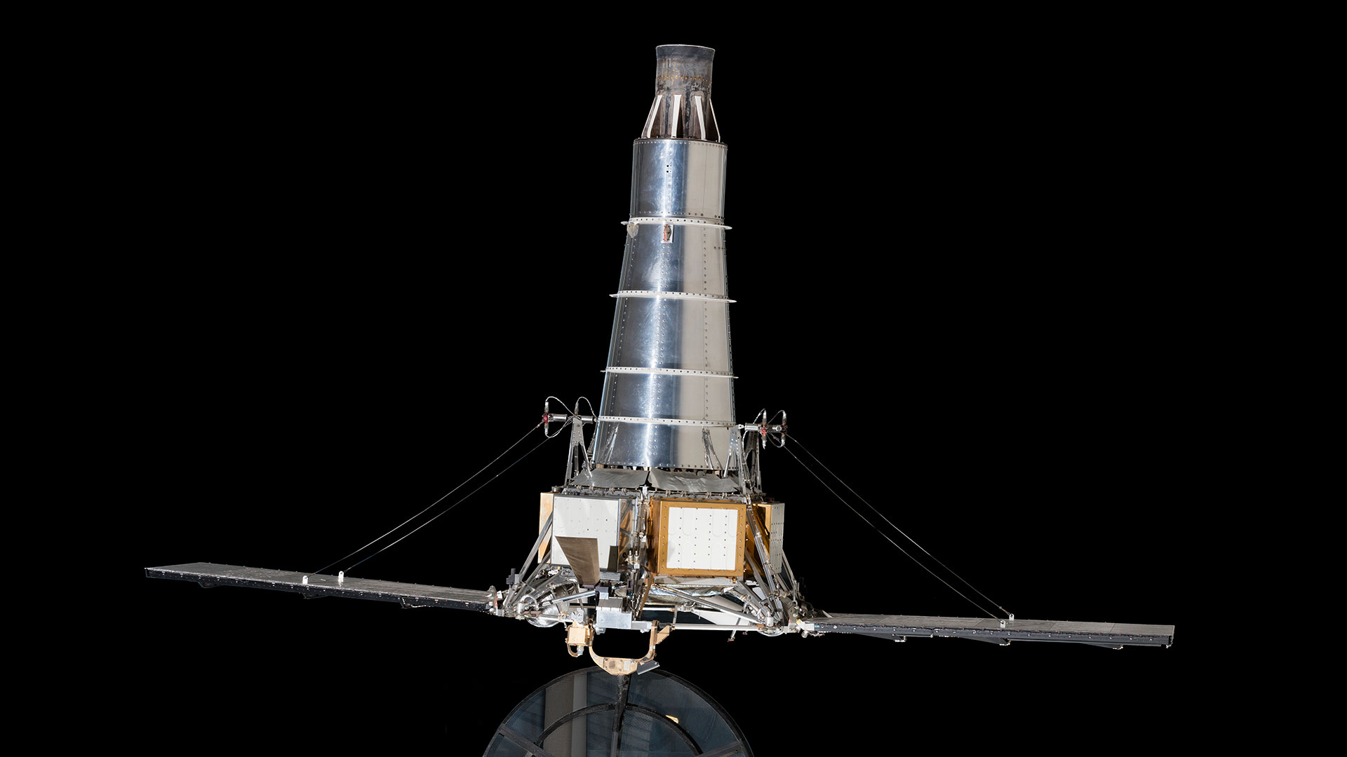 a small space probe with a conical extension and solar panels