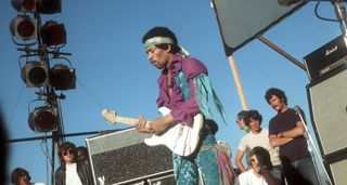 Jimi Hendrix plays a white Fender Stratocaster on a hut summer's day at Devonshire Downs, California