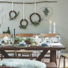 Florist wreaths hanging from a foraged branch