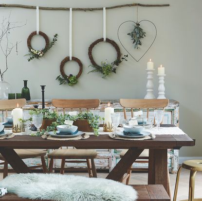 Florist wreaths hanging from a foraged branch