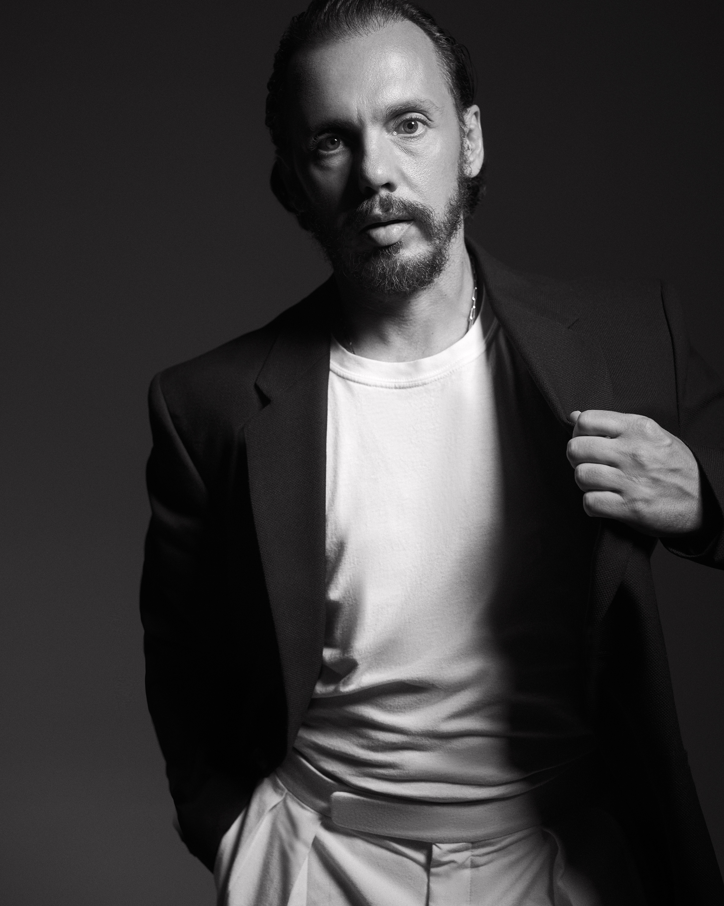 Franck Izquierdo poses for a black-and-white headshot.