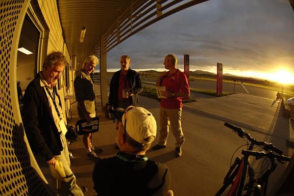 Officials prepare in the early morning light.