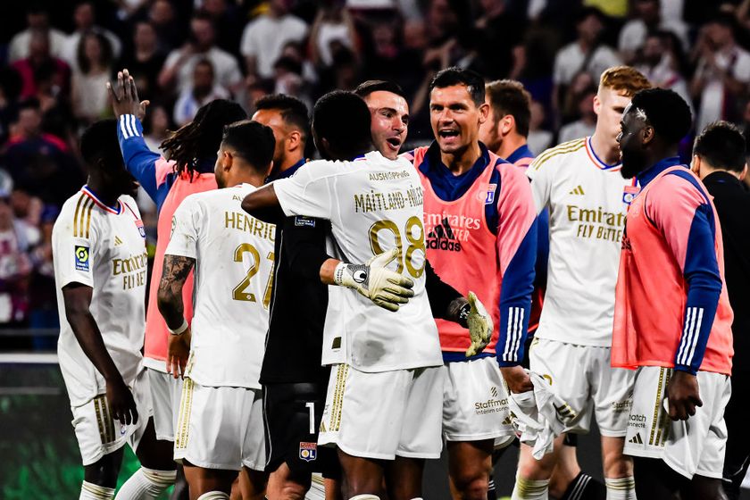 Goalkeeper Anthony Lopes of Lyon (L) celebrates with his teammate Ainsley Maitland-Niles of Lyon (C) after winning Brest during the Ligue 1 Uber Eats match between Olympique Lyonnais and Stade Brestois 29 at Groupama Stadium on April 14, 2024 in Lyon, France.