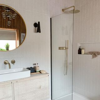 bathroom with white wall tile and wall mirror