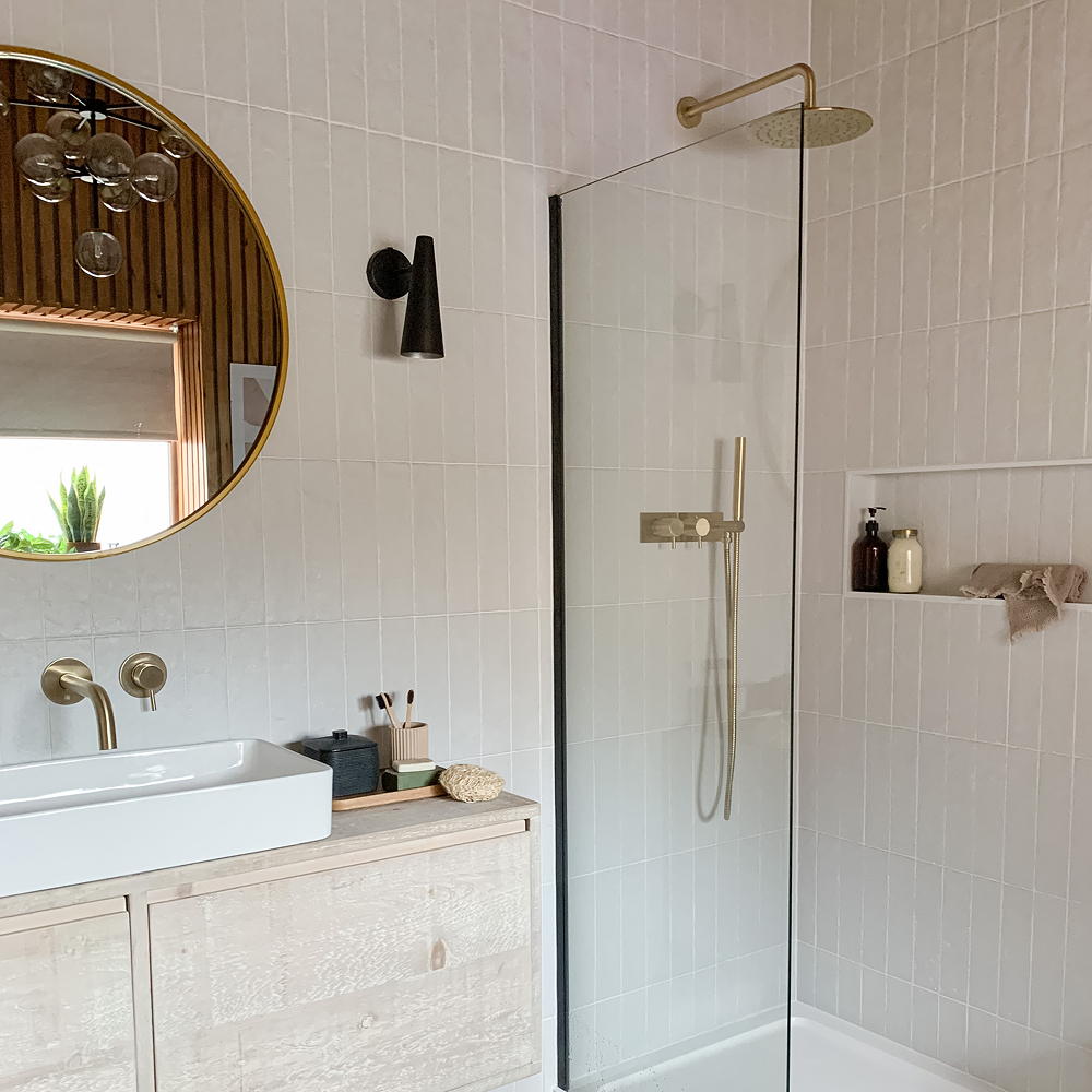 bathroom with white wall tile and wall mirror