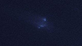 This photo from the Hubble Space Telescope shows the rare sight of the asteroid P/2013 R3 breaking apart. This image, the fourth in a series, was taken on Jan. 14, 2014. Image released March 6, 2014.