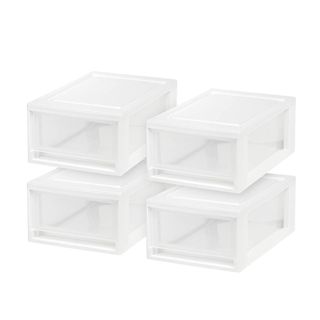 A set of four clear stackable drawers