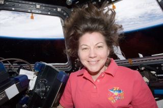 NASA astronaut Cady Coleman is seen inside the cupola on board the International Space Station in 2011.