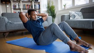 Man performing crunches on the floor