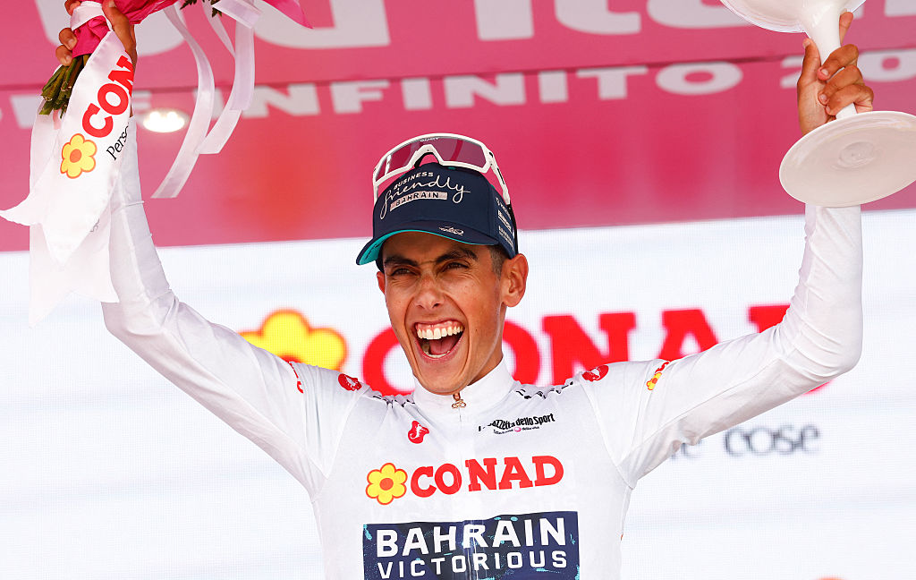 Bahrain - Victorious Portuguese rider Afonso Eulalio celebrates on the podium with the best young rider's white jersey after the 20th stage of the Giro d'Italia 2026 - Tour of Italy cycling race between Gemona del Friuli and Piancavallo, Italy, on May 30, 2026. (Photo by Luca Bettini / AFP)