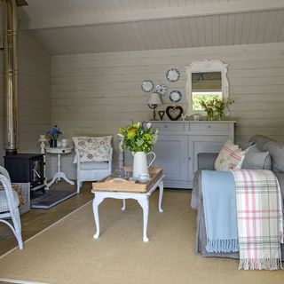 country summerhouse with panelling and woodburner