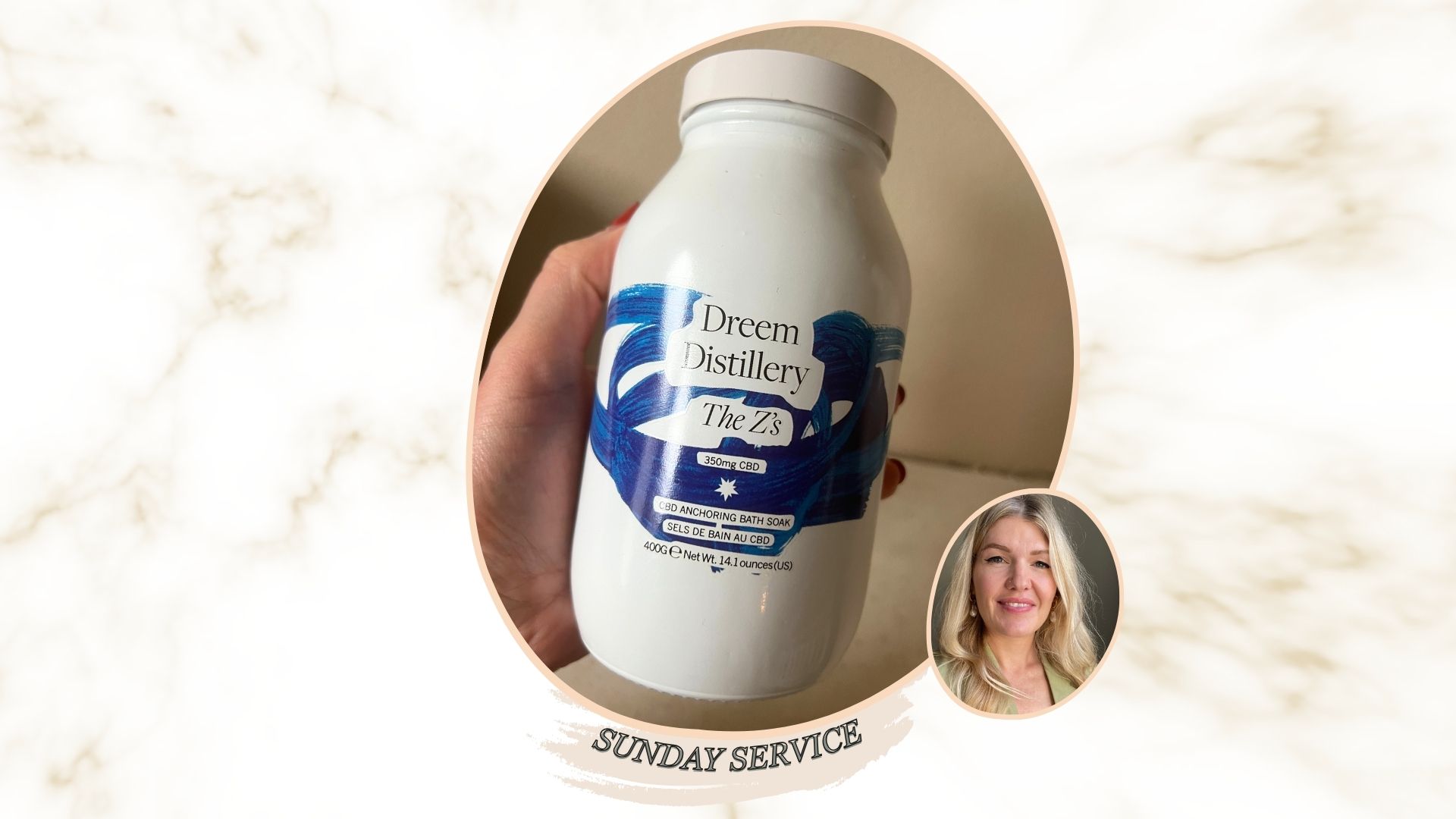 A blue and white jar of Dreem Distillery bath salts held in the palm of a hand, next to an image of the bath salts, spilled out into a jar lid, showing their golden colour and texture