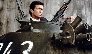Goldeneye Pierce Brosnan peeks out of a tank with a gun