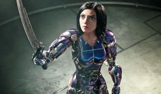 Alita: Battle Angel sword raised in defiance