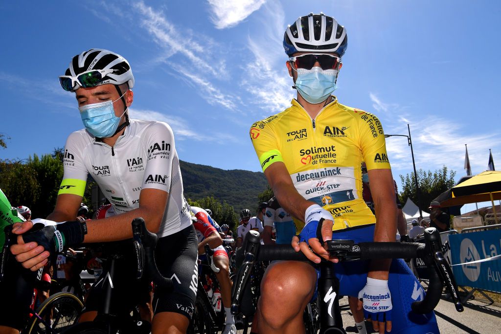 SAINTVULBAS FRANCE AUGUST 08 Start Erik Fetter of Hungary and Team KometaXstra White Best Young Jersey Andrea Bagioli of Italy and Team Deceuninck QuickStep Yellow Leader Jersey Covid safety measures during the 32nd Tour de LAin 2020 Stage 2 a 141km stage from Lagnieu to Llex MontsJura 896m tourdelain TOURDELAIN TDA on August 08 2020 in SaintVulbas France Photo by Justin SetterfieldGetty Images