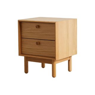 A solid wood bedside table