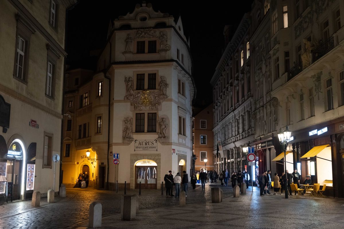 A street in Prague lit up at night