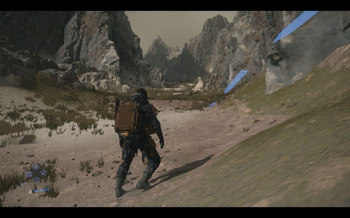 A man stands in a wide valley