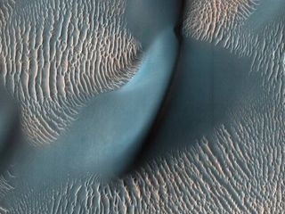 An image by a camera aboard the Mars Reconnaissance Orbiter of Martian sand dunes.