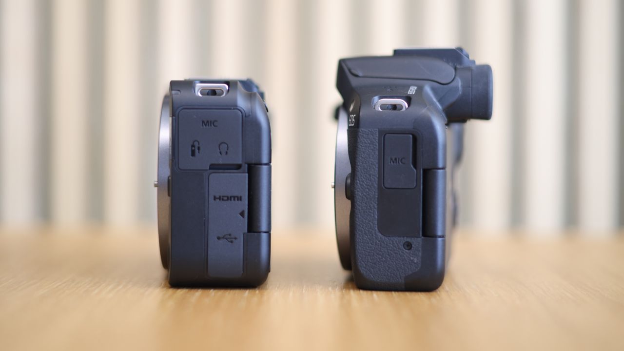 Canon EOS R50 V side by side with a Canon EOS R50 on a wooden surface