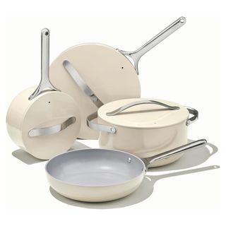 Four white enamel pots and pans