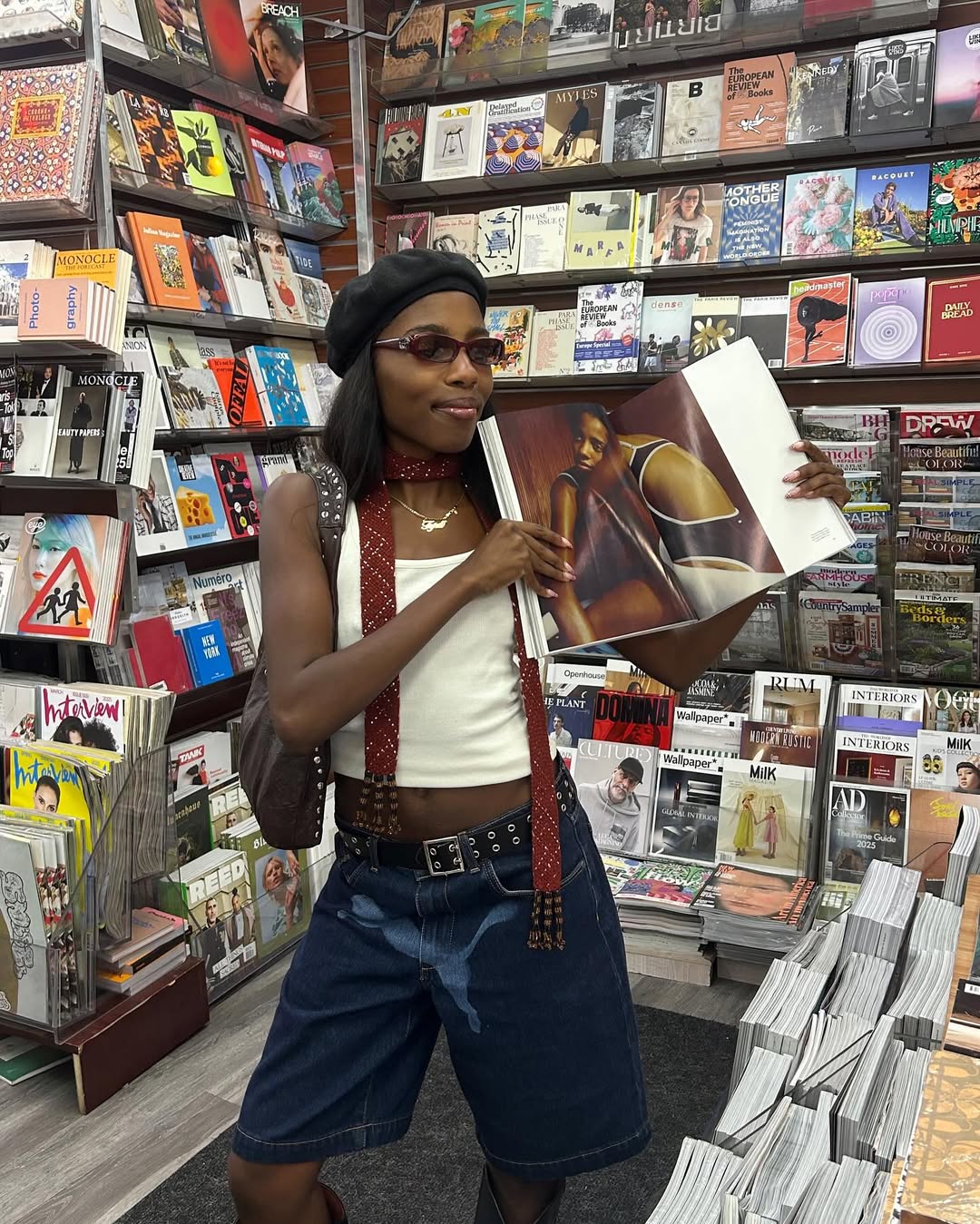 Tyra Booker wearing a skinny scarf