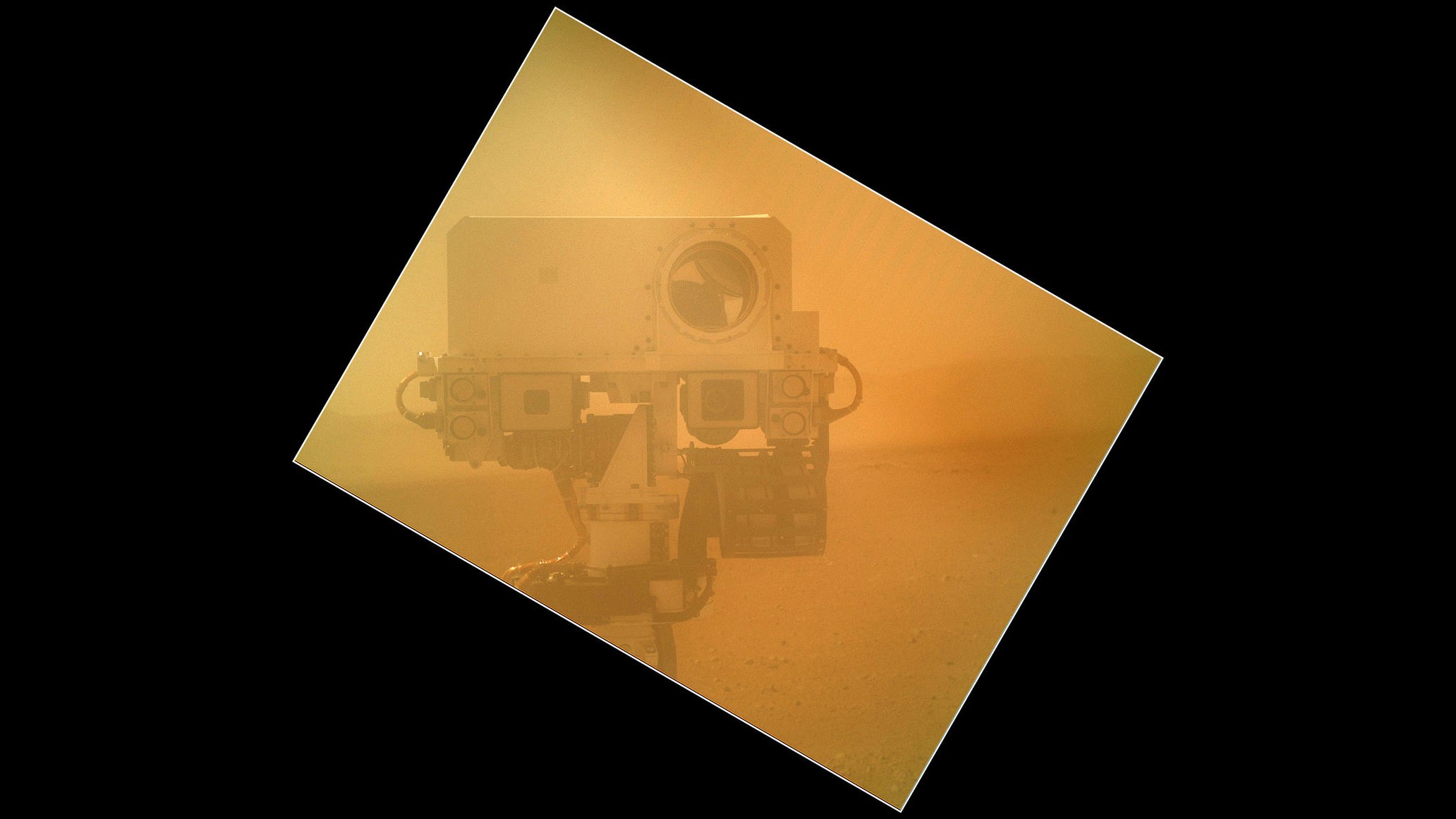 the top of the Curiosity rover reflected