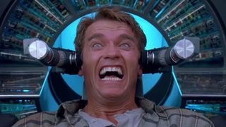 Arnold Schwarzenegger as Douglas Quaid screaming during one of the best sci-fi movies, Total Recall.