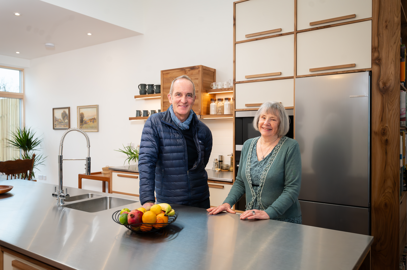 Kevin McCloud in a kitchen with an 82 year old widow