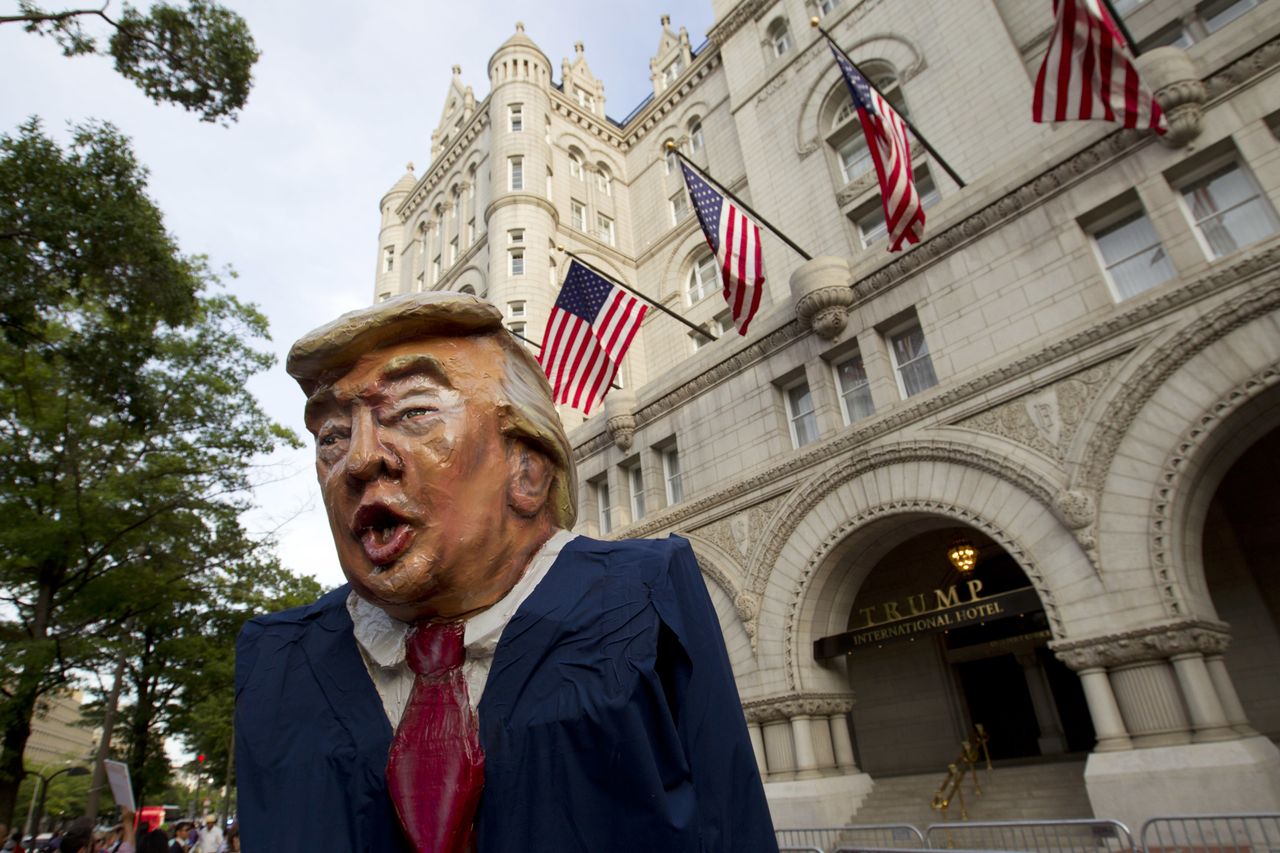 A protester dressed as President Trump.