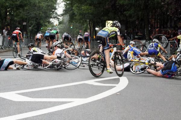 And they all fall down...wet white lines prove hazardous sending at least 2 riders to the hospital.