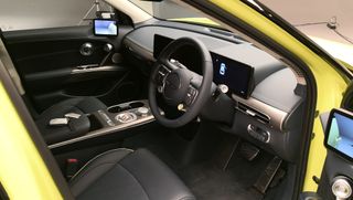 View into Genesis GV60 from open driver's door