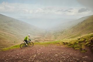 Image shows rider on a gravel ride in Wales.