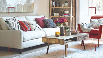 Neutral living room with red accent accessories to support Kelly Hoppen&#039;s accent colour styling tip