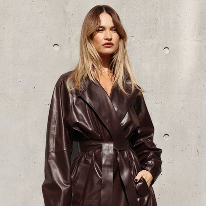Lily James with hair bronzing and leather trench