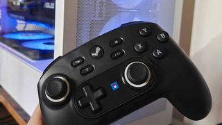 Horipad for Steam in front of white PC.