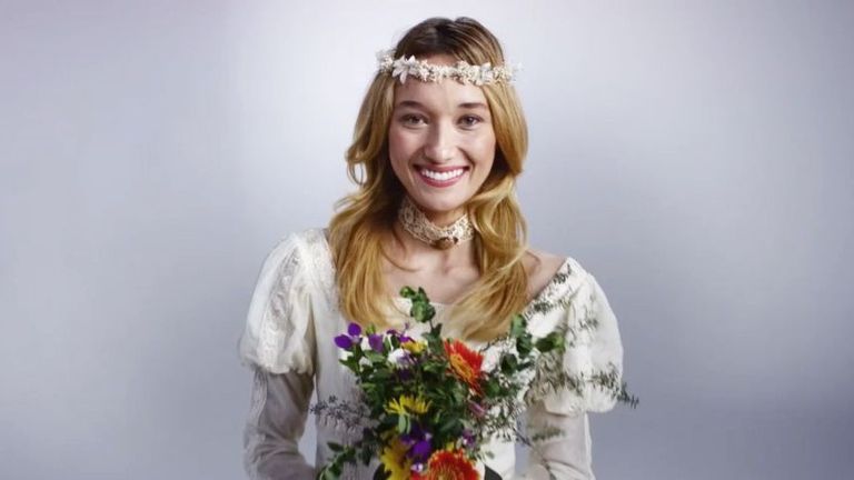 Woman in wedding dress holding bouquet