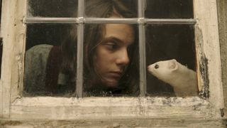 Lyra and Pantalaimon (voiced by Kit Connor) in His Dark Materials.