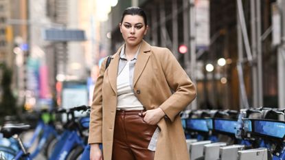 new york, new york february 25 model lauren chan is seen wearing a tan coat, white shirt, brown pants outside the christian siriano show during new york fashion week fw21 on february 25, 2021 in new york city photo by daniel zuchnikgetty images