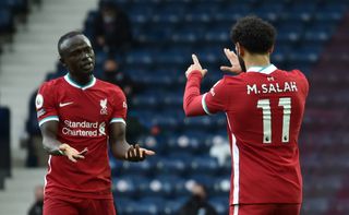 Liverpool’s Mohamed Salah (right) celebrates with Sadio Mane after scoring their side’s first goal of the game during the Premier League match at The Hawthorns, West Bromwich. Picture date: Sunday May 16, 2021