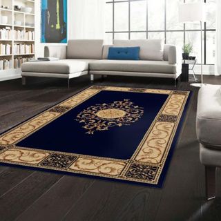 A dark blue and gold patterned rug from Wayfair