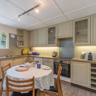 kitchen with grey wall and table and chair