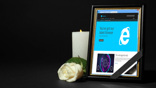Funeral with Internet Explorer logo in a photo frame and a candle burning