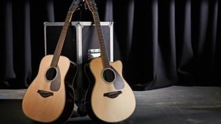 A Yamaha FG830 acoustic guitar (L) and a Yamaha FSX830C electro-acoustic guitar on stage