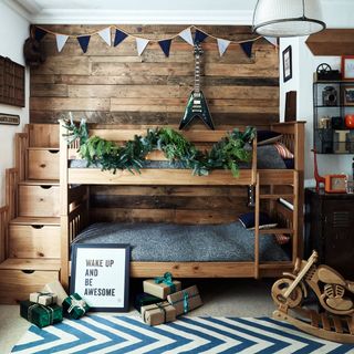 childs bedroom with wooden bunk bed and carpet floor