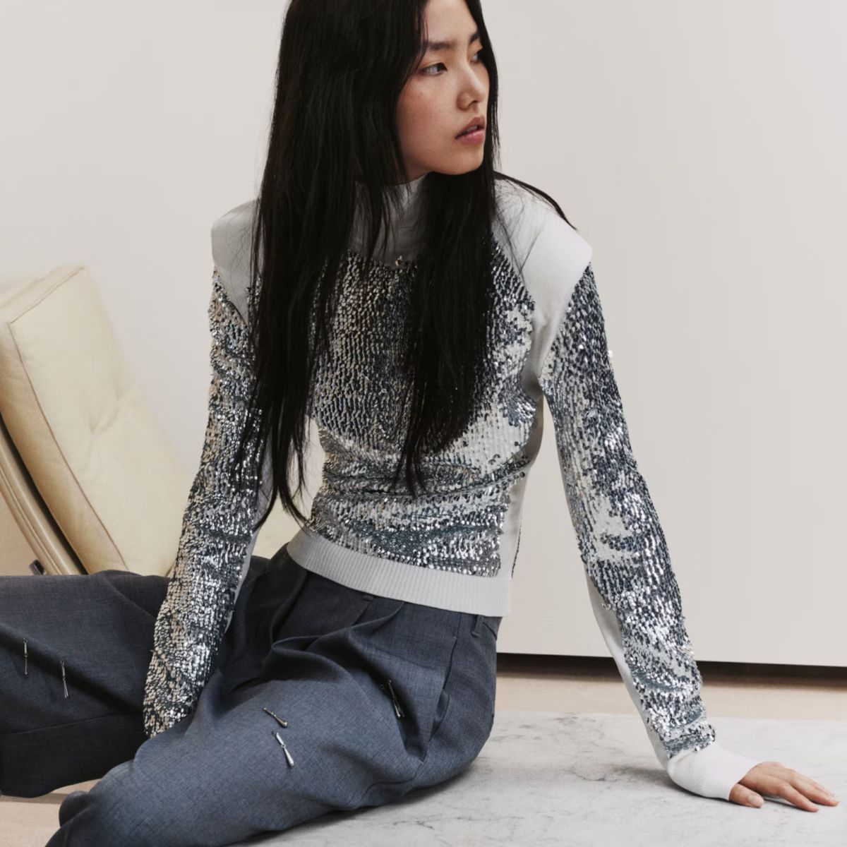 a model wears an embellished christmas jumper from H&amp;M