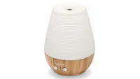 Beurer LA 40 aroma diffuser, with bamboo base and cream ceramic top section