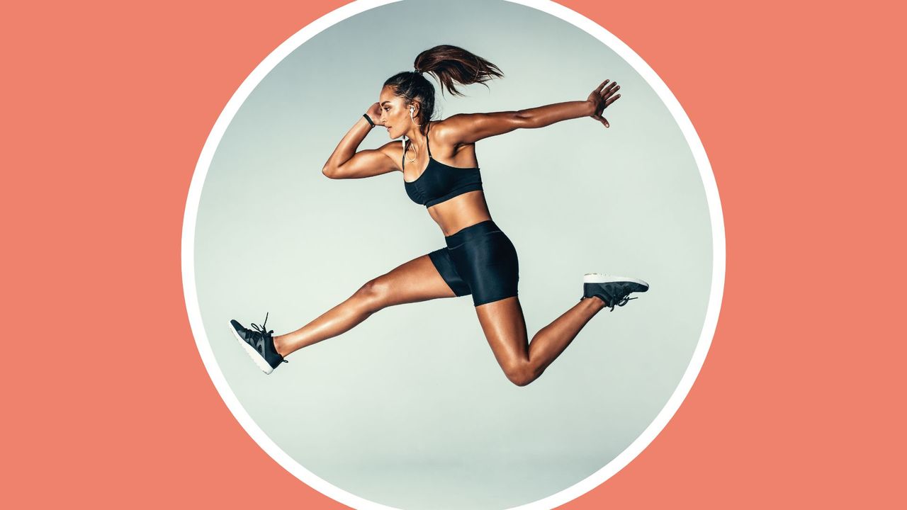 Side view of fit young woman jumping against grey background. Female model in sports wear jumping in air.