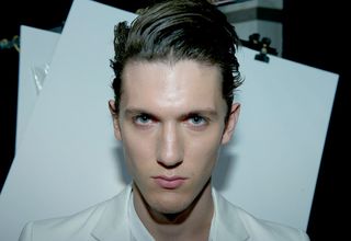 head shot of male model with styled back hair